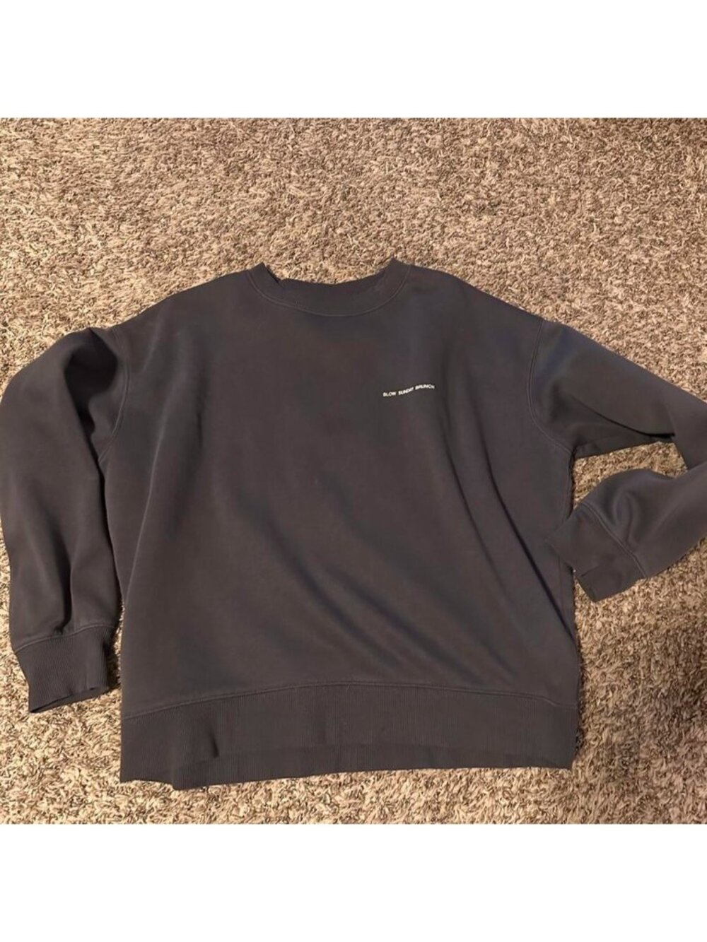 Black crewneck sweatshirt with white text reading 'SLOW SUNDAY BRUNCH', size M